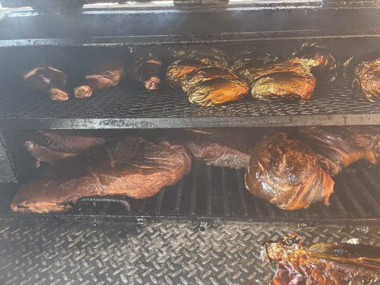 Meat smoking on the pit